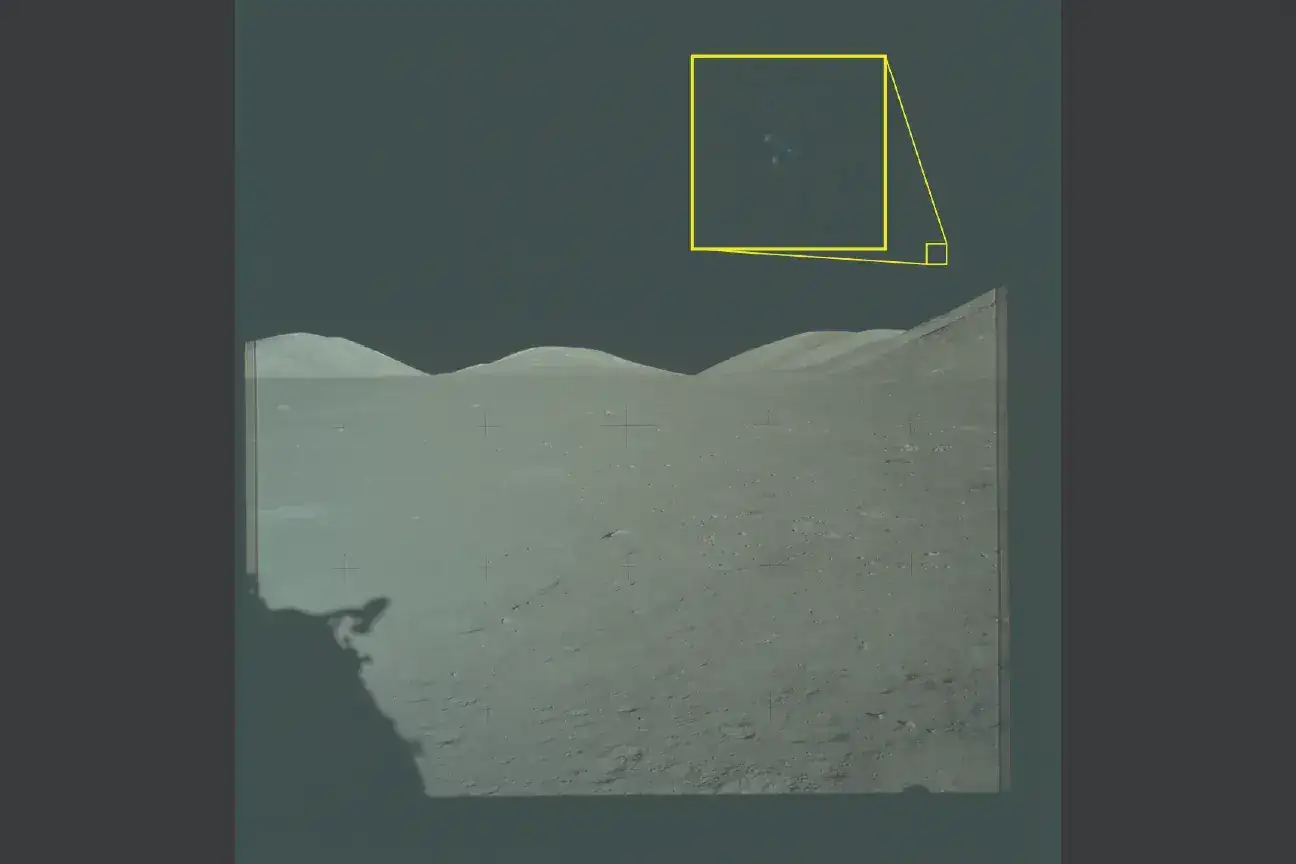 NASA Apollo 17 lunar photograph with three lights visible in triangular formation above lunar terrain